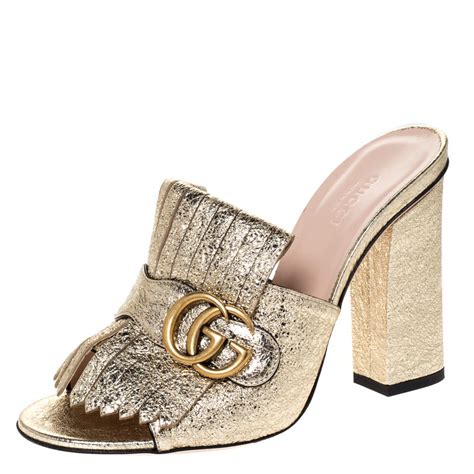 gucci gold mules.